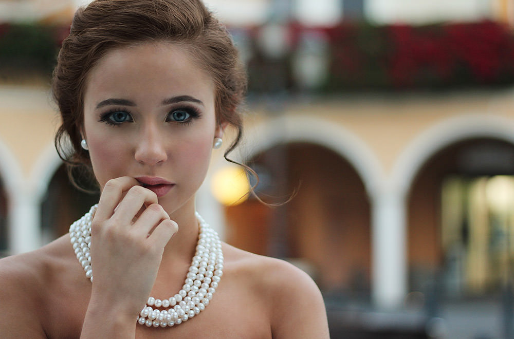 woman wearing jewellery and posing